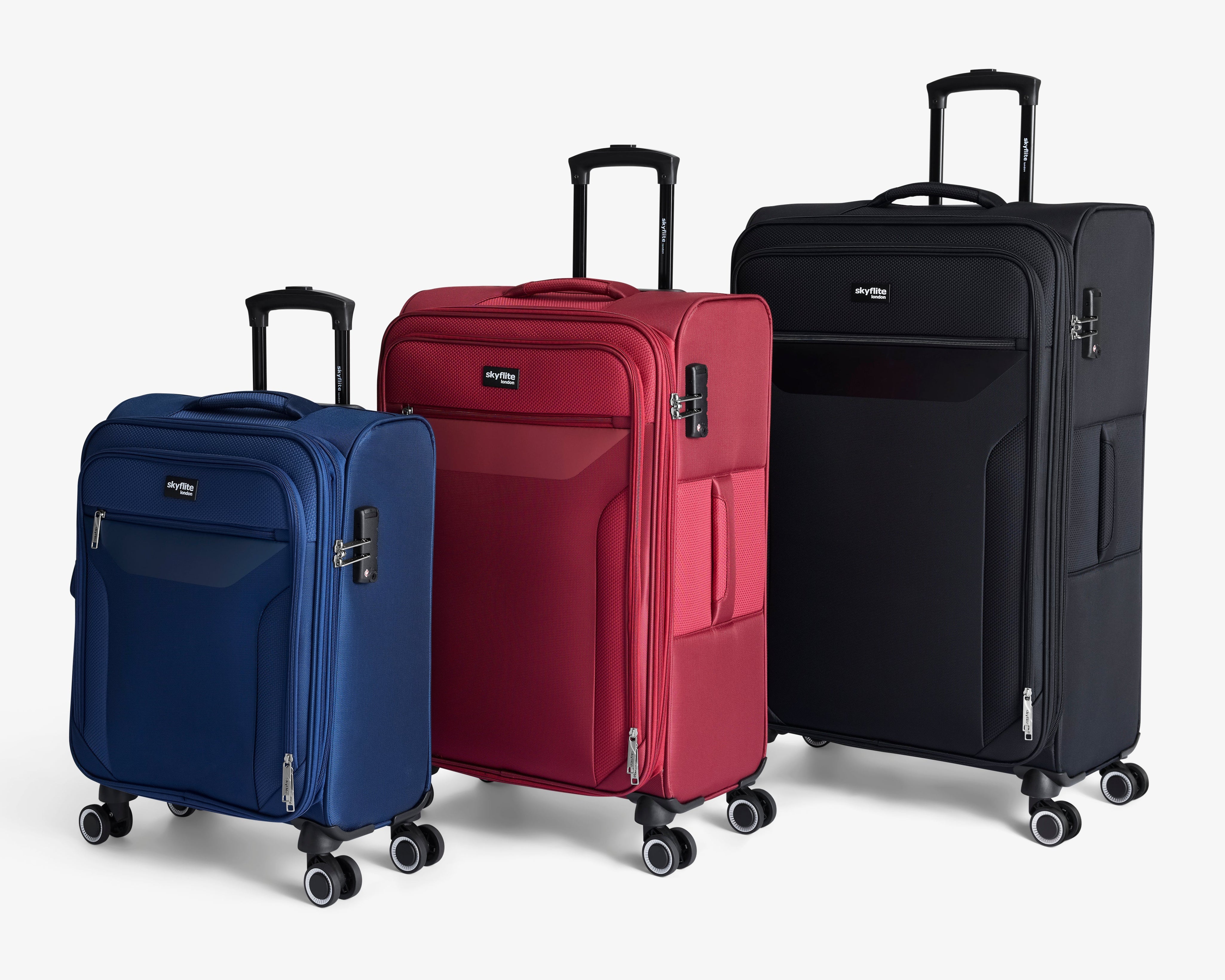 The Skyflite Virage luggage collection shown as a set of three sleek, durable suitcases in large black, medium teal, and small silver.