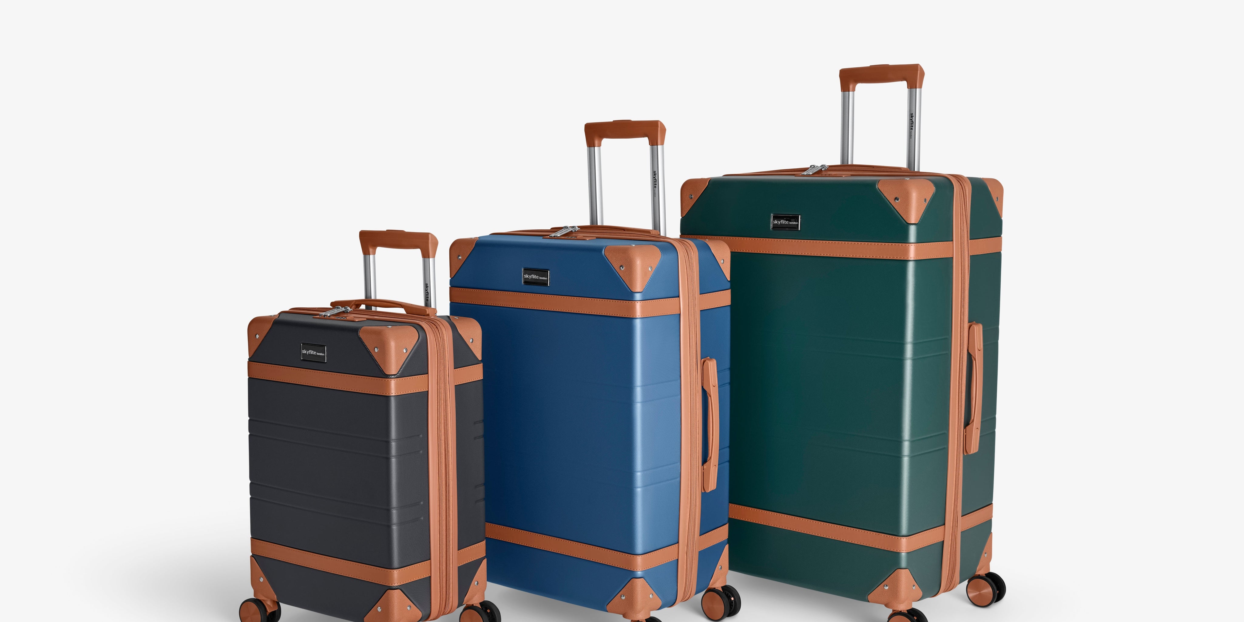 Three-piece Skyflite Retro luggage set with durable, hard-shell trolley cases in black, cream, and light blue, arranged by size.