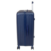Side profile of the navy blue Skyflite Modern XL Trunk, an 86cm hardshell suitcase featuring eight smooth-rolling spinner wheels and a side carry handle.