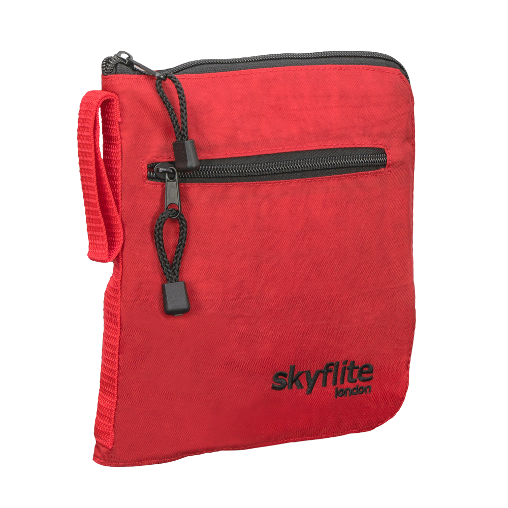 Red Skyflite folding onboard travel bag shown neatly folded into its compact, zippered pouch for easy storage.